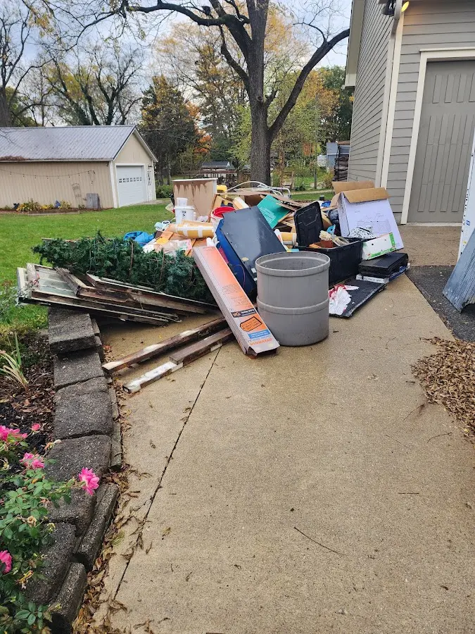 Dumpster being loaded with debris for 3 Yard Dumpster Rental in Trenton
